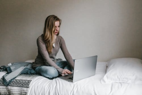 girl laptop bed