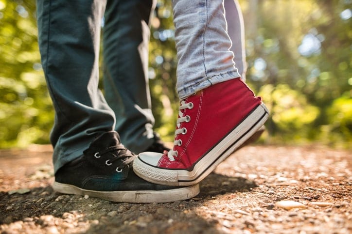couple on tip toes cropped shot