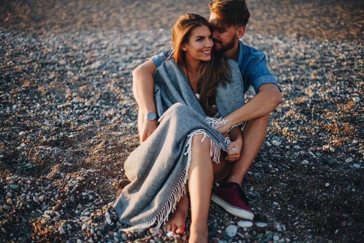 couple hugging on the beach