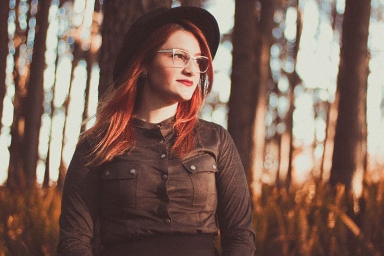 red haired glasses woman