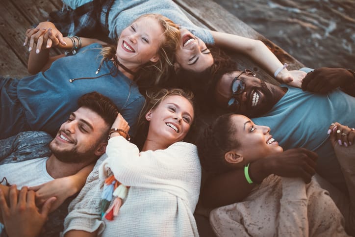 group of friends laying down