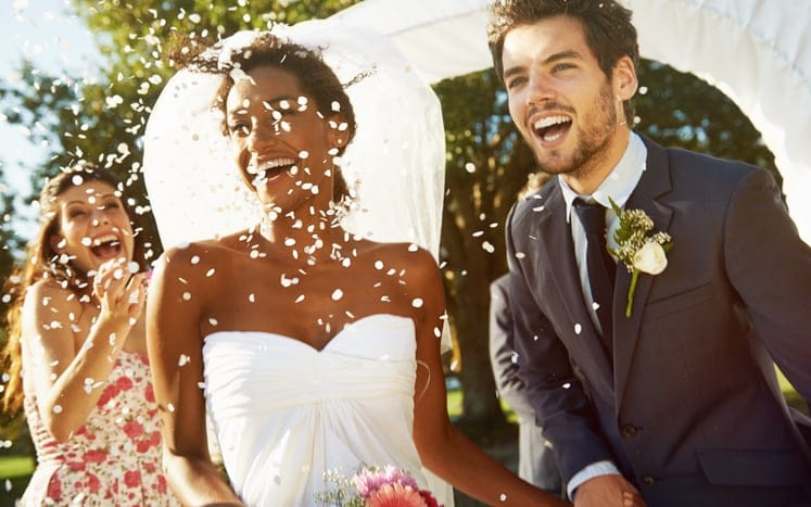 couple getting married smiling