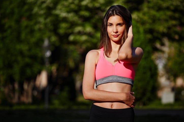 sport girl standing in the beautiful park