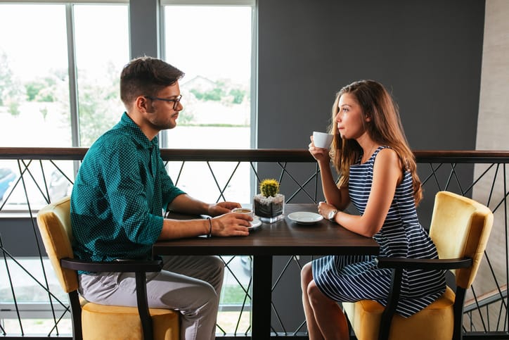 Shot of a couple having a conversation over coffee at the restaurant
