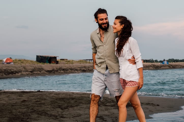 Happy couple on a date on the water.
