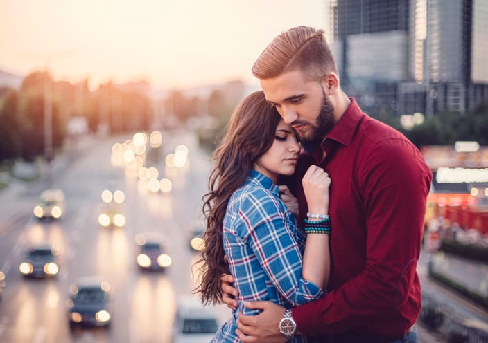 Young couple emracing outside