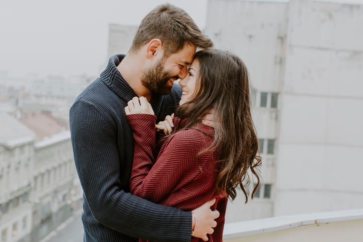 couple embracing outsid