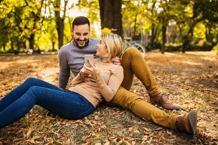 romantic couple in autumn leaves