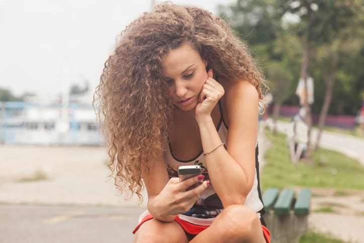 Woman scrolling social media.