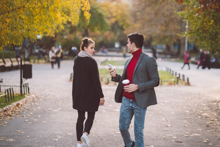 two people flirting in the park