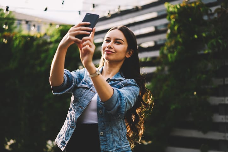 Woman taking a selfie.
