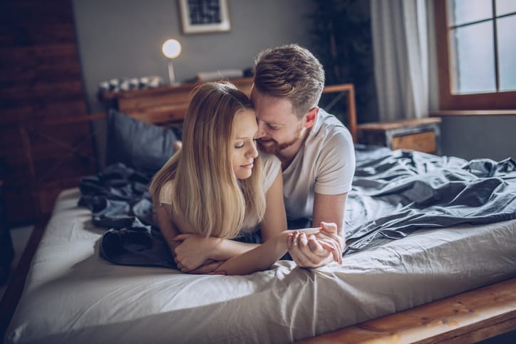 couple being intimate in the bedroom