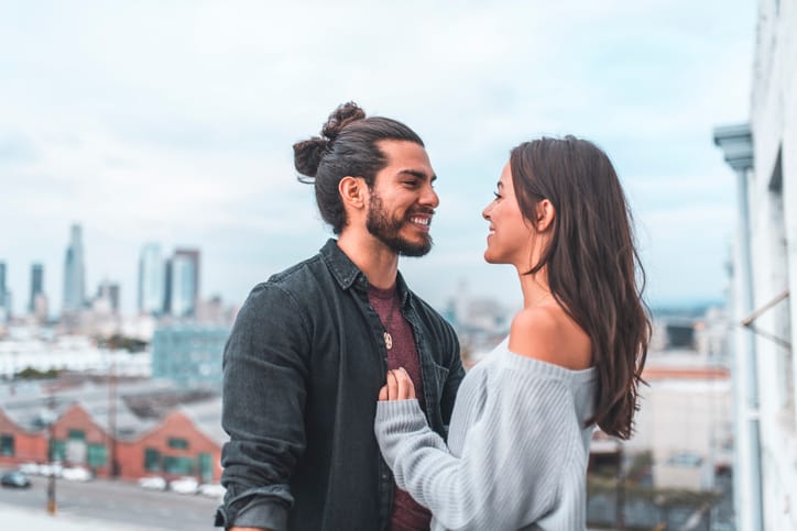 man and woman facing each other
