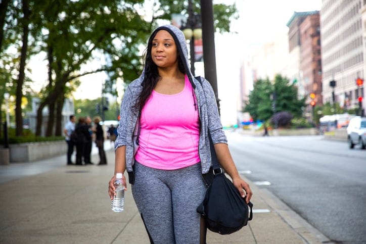 black woman in gymwear outside