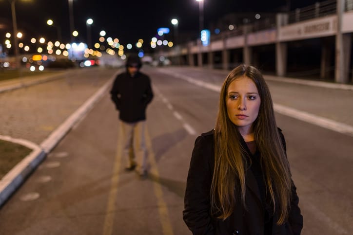 A woman being stalked on the street.