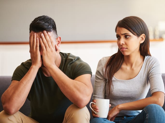 Unhappy couple living together.