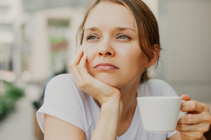 pensive woman coffee