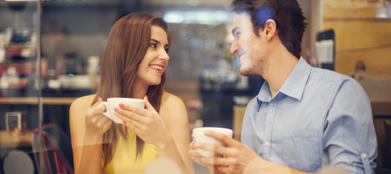 A young couple having coffee in a cafe