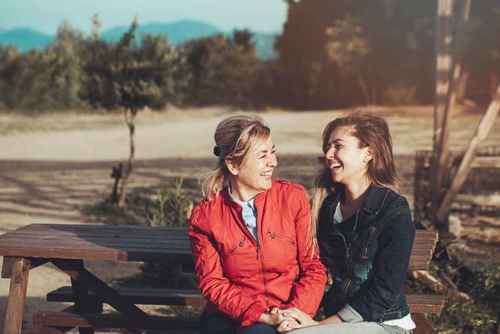 Smiling mother with young daughter