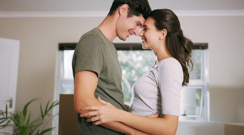 Young couple embracing.