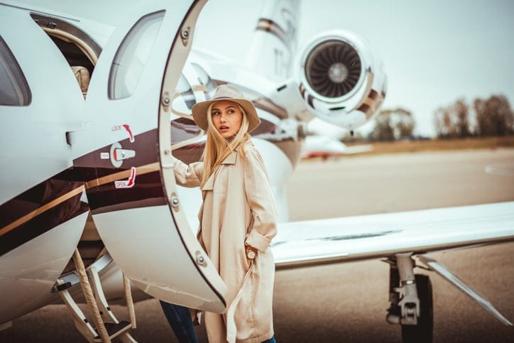 Fancy woman getting on a plane.