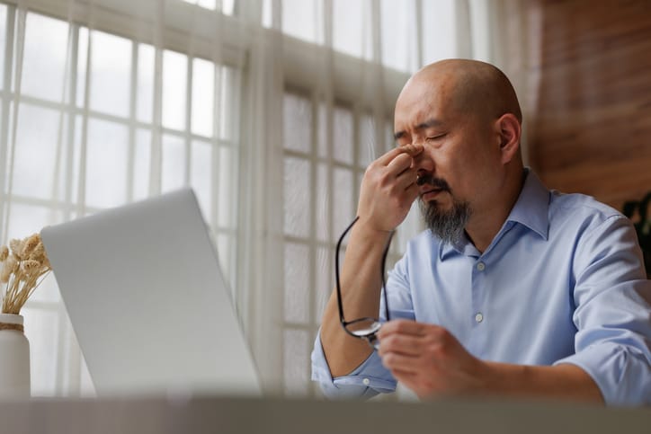 stressed man at work computer