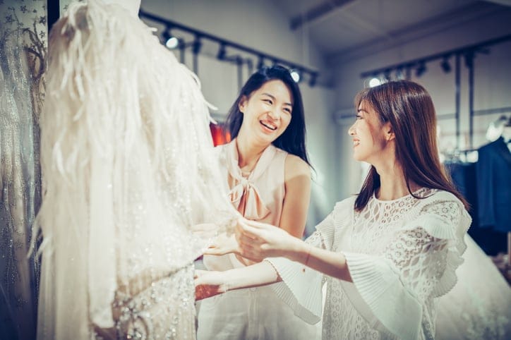 best friend at bridal shop