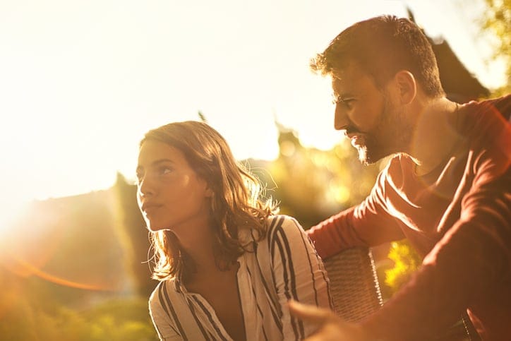 Couple unhappy in the outdoors.