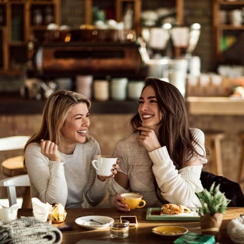 women at a coffee bar