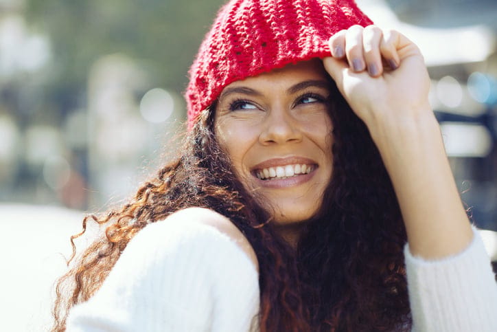 woman in red beanie hat