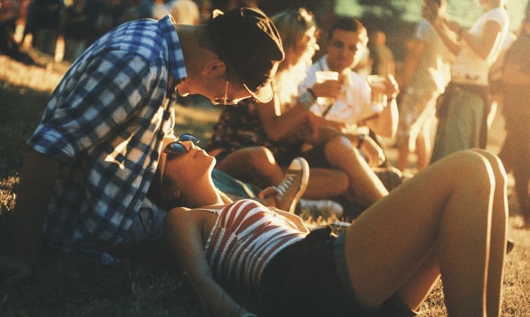 young trendy couple at the beach