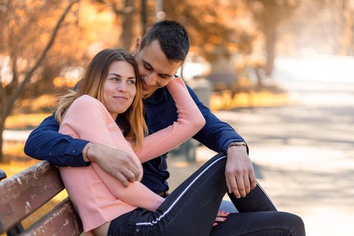 Couple having an uncomfortable hug