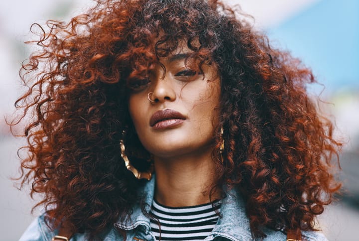 curly haired african american woman serious