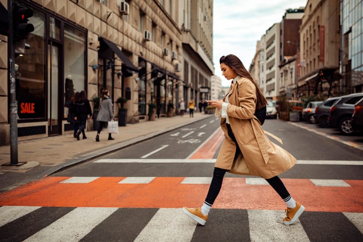 woman outside crossing the street