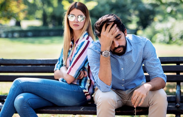 couple having difficulties sitting outside
