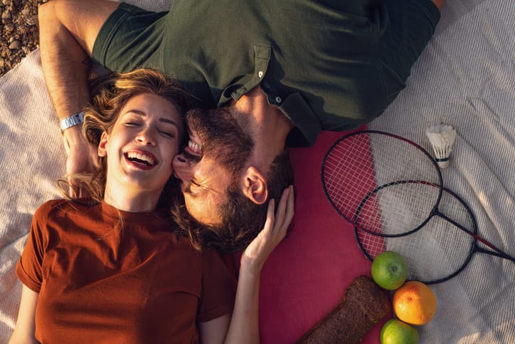 happy couple lying in sun