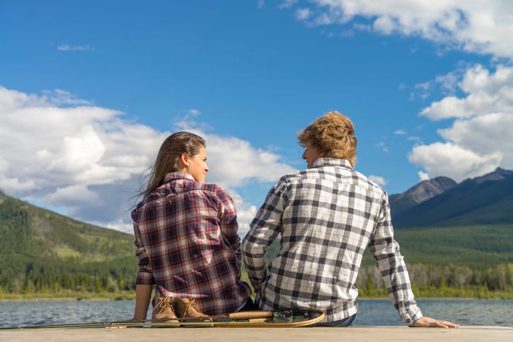couple sitting on dockside