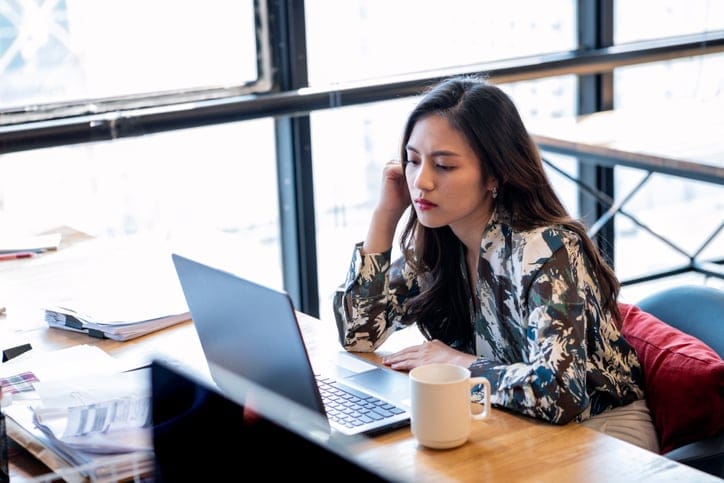 Woman at her desk.