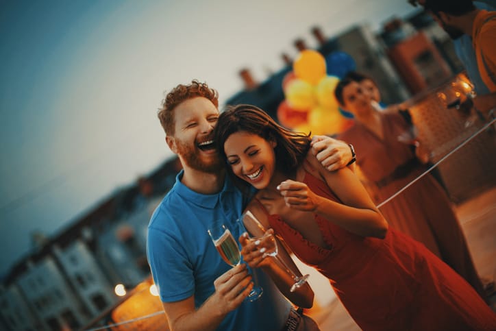 couple laughing and joking at carnival