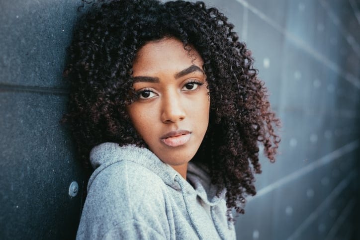 african woman looking sad