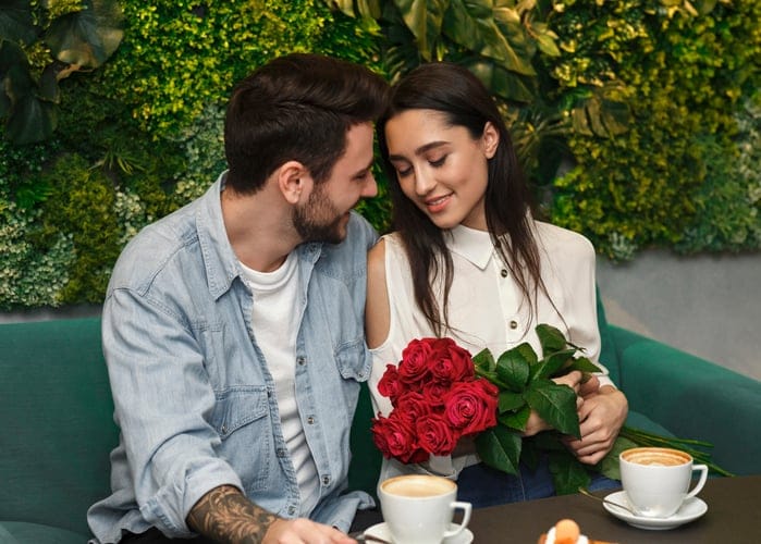 romantic couple getting close at cafe