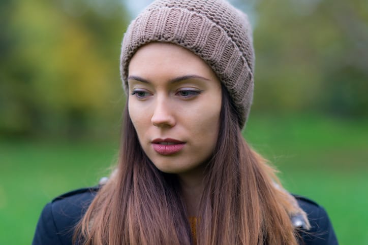 Portrait of young woman in the autumn forest
