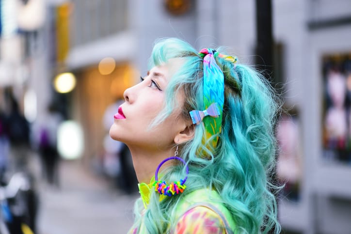 asian woman with bright hair color