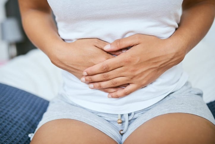 Woman having period cramps.