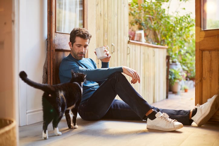 Man being lazy with his dog.
