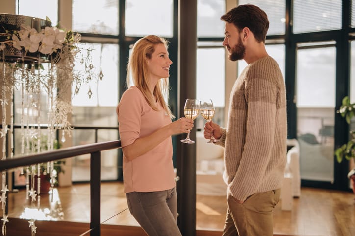 Couple enjoying wine at home.