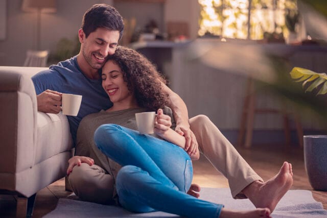 happy couple relaxing at home