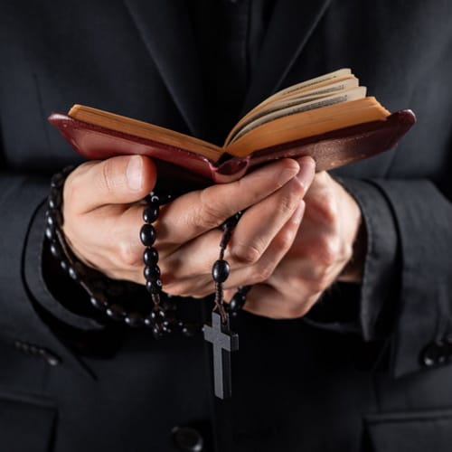priest holding bible