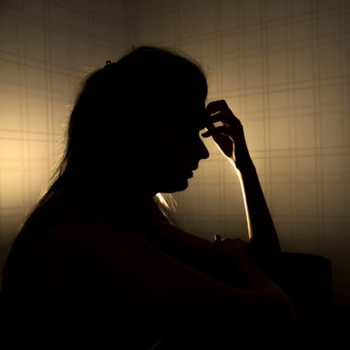 sad woman profile in dark head is put down, stressed young girl touching head and thinking