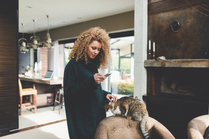 serious woman staring at phone texting